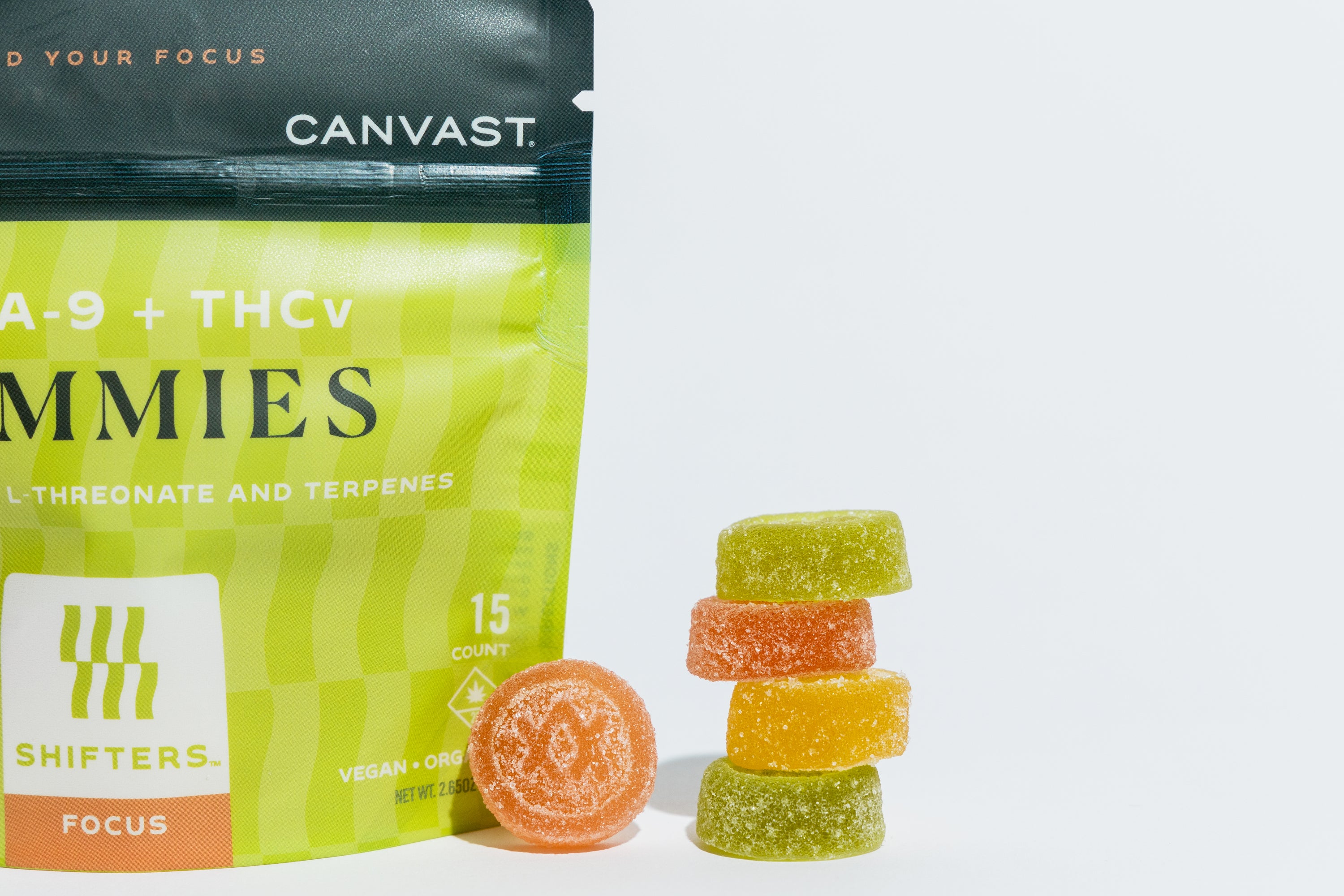 A 15ct bag of Canvast Shifters Delta-9 Focus Gummies with gummies stacked next to it