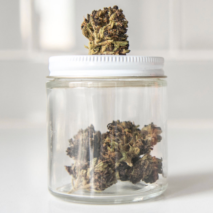 Jar of Premium Organic Hemp Flower with a hemp bud on top.