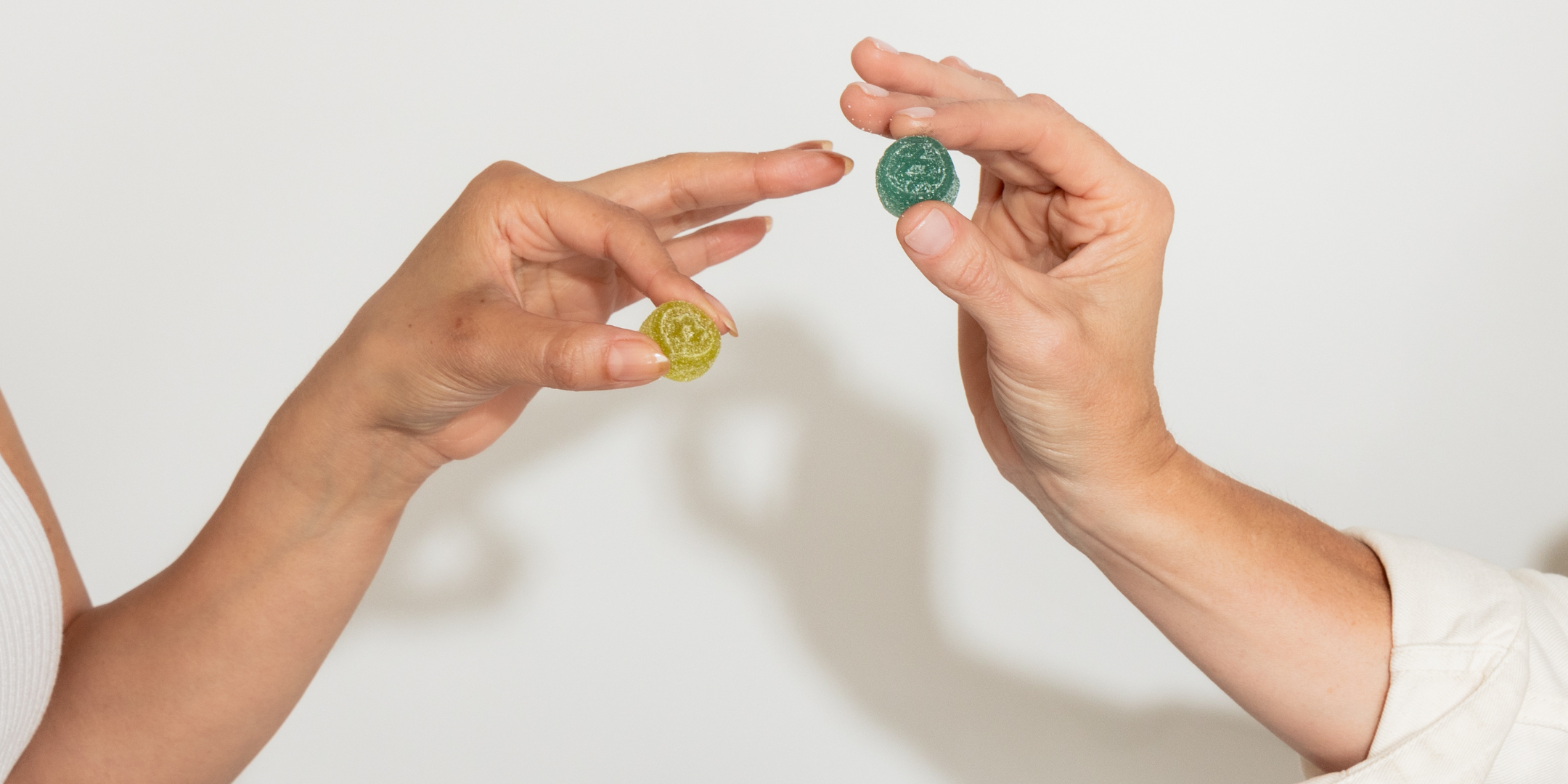 Hands holding 3 bags of Canvast Hard Candies; Lifters, Shifters, and Drifters varieties