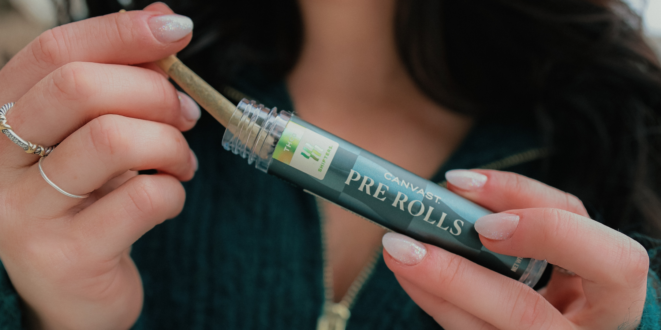 Woman pulling pre roll out of a Canvast THCa Shifters pre roll tube