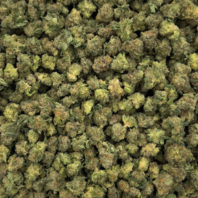 Candy Marker hemp flower strain displaying sticky, crystal-covered buds with vibrant green coloring and orange hairs.