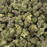 Pineapple Breeze hemp flower strain showing fluffy, resinous buds with lime green coloring and amber hairs.