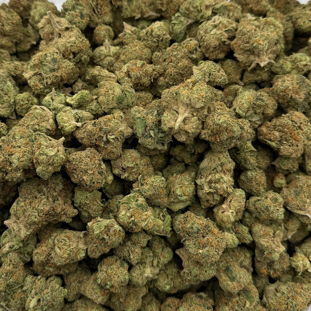 Durban Poison hemp flower with chunky, resin-coated buds and golden-green coloration