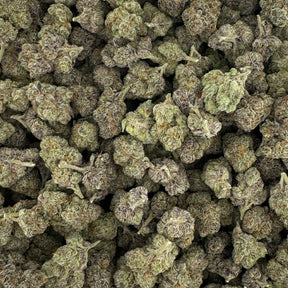 Red Velvet hemp flower strain showcasing dense, dark green buds with hints of purple and a heavy layer of frosty trichomes.